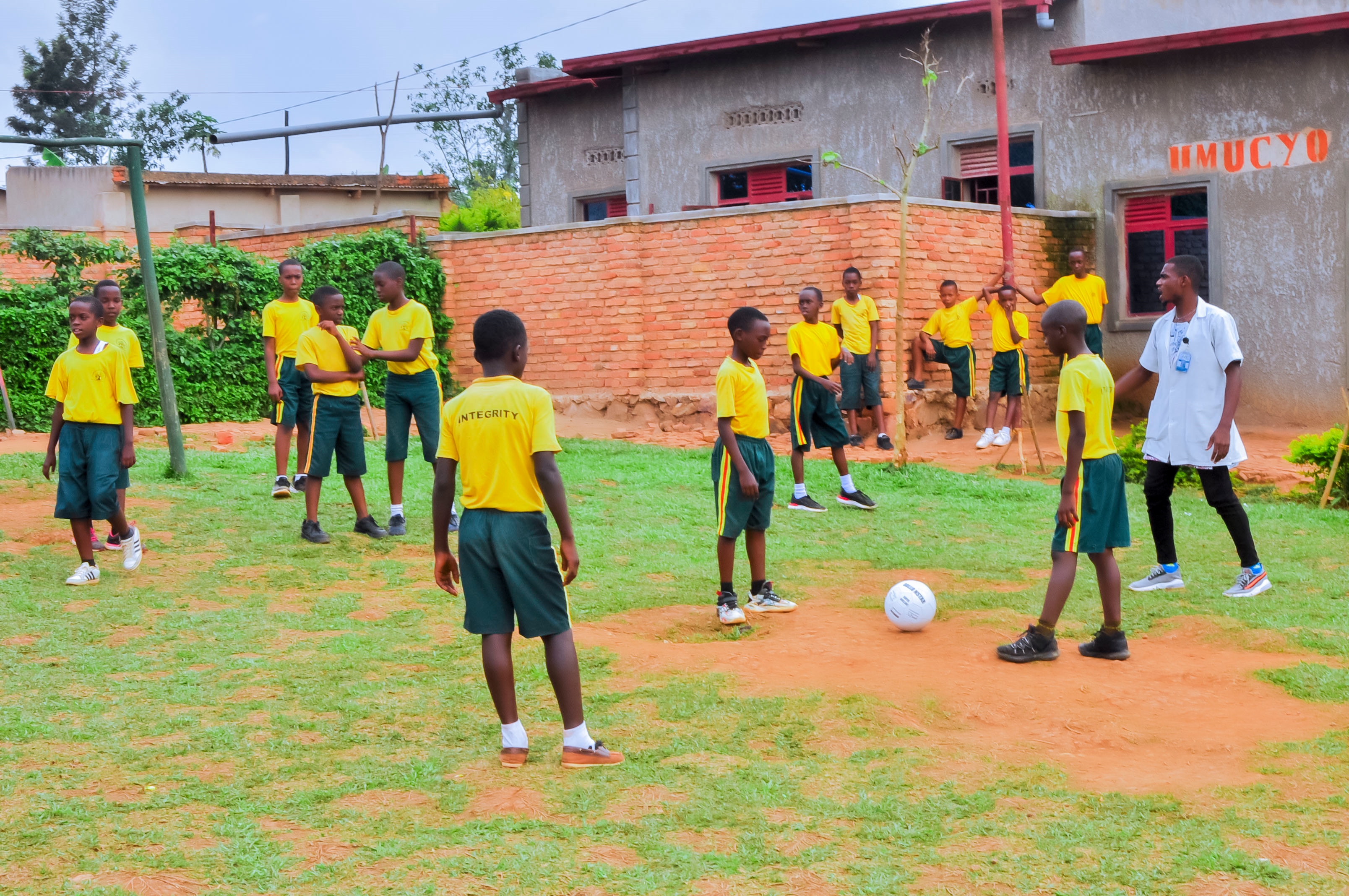 Oleander pupils playing outdoors with a teacher